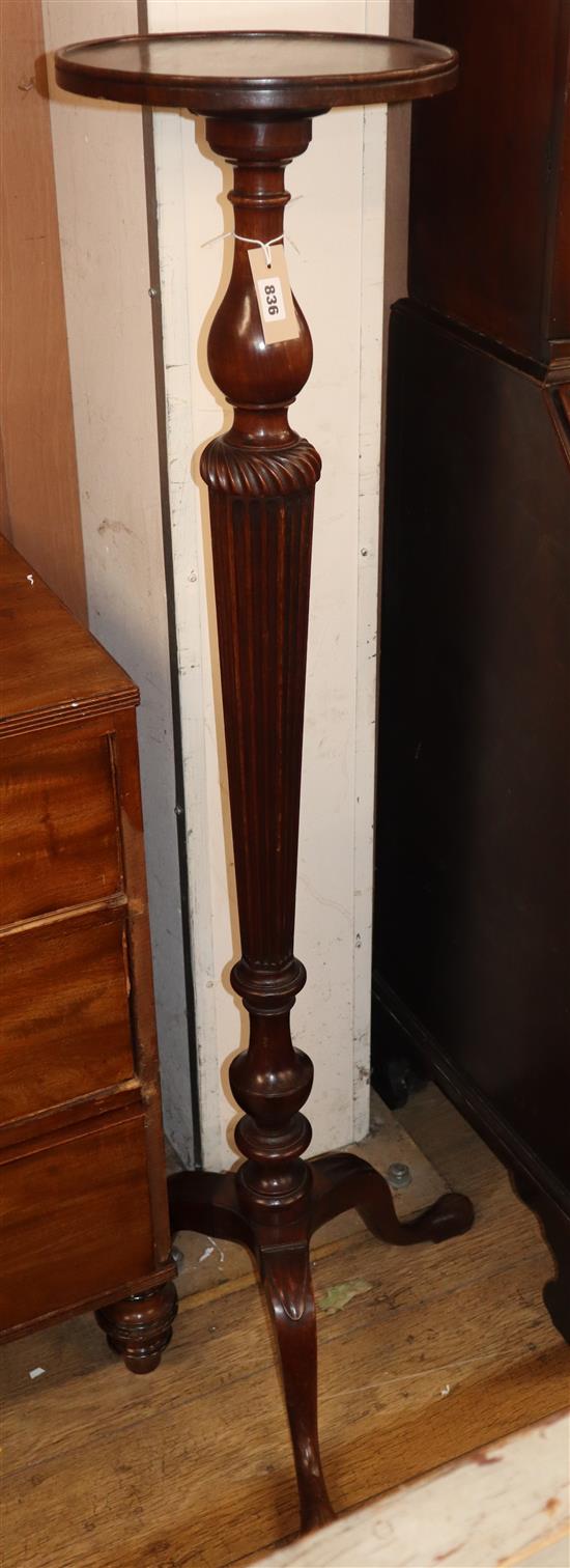 A mahogany torchere, with fluted column